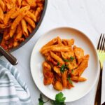 The most delicious, creamiest chicken penne pasta recipe with tomatoes cooks in under 30 minutes in one pot! This easy tomato chicken pasta recipe uses chicken breast, penne pasta, tomatoes, onions, garlic, herbs and spices, salt, and pepper. You will make this simple dish over and over again! Chicken pasta is a simple dish for lunch or dinner that comes together quickly on the stovetop in a pan/skillet. The best part is that this pasta recipe doesn’t require cheese to taste great.