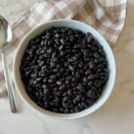 This is How to Cook Black Beans From Scratch. This Dry Beans Recipe guarantees the perfect beans Every Time, and it is the easy Perfect Recipe. Let's cook Dry Black Beans at home! How many times have you passed a bag of dry black beans and heads over to grab the canned ones? I beg you to stop using those sad canned black beans and start cooking them dry from scratch. Not only are canned black beans expensive, but they may equally be less nutritious and taste weird. If you favor canned beans over dry because you do not know how to make them, it ends today! I’m showing you an easy yet tasty way to cook black beans from scratch. This would be the best black beans you have ever had.