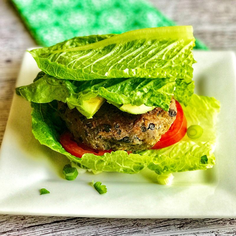 Healthy Black Bean Burger Lettuce Bun Recipe is Gluten-Free, tasty and nutritious! Want a healthy vegetarian burger that doesnโt skimp on flavor? This nutritious black bean veggie burgers recipe is what you need. If you have ever wondered how to make tasty vegetarian burgers, wonder no more. This black bean veggie burger recipe is quick and easy to follow. Not only easy to make, this is perfect for beginner chefs and packed with healthy and nutritious ingredients that your body will love. This wholesome vegetarian burger is what you need for your next meal prep. This veggie burger is gluten-free, vegetarian, and lower in calories and saturated fats than its meat burger counterparts. This makes the perfect recipe for backyard BBQ, picnics, Memorial Day, and Fourth of July. If ready, letโs make this easy black bean burger from scratch and serve it on a lettuce bun!