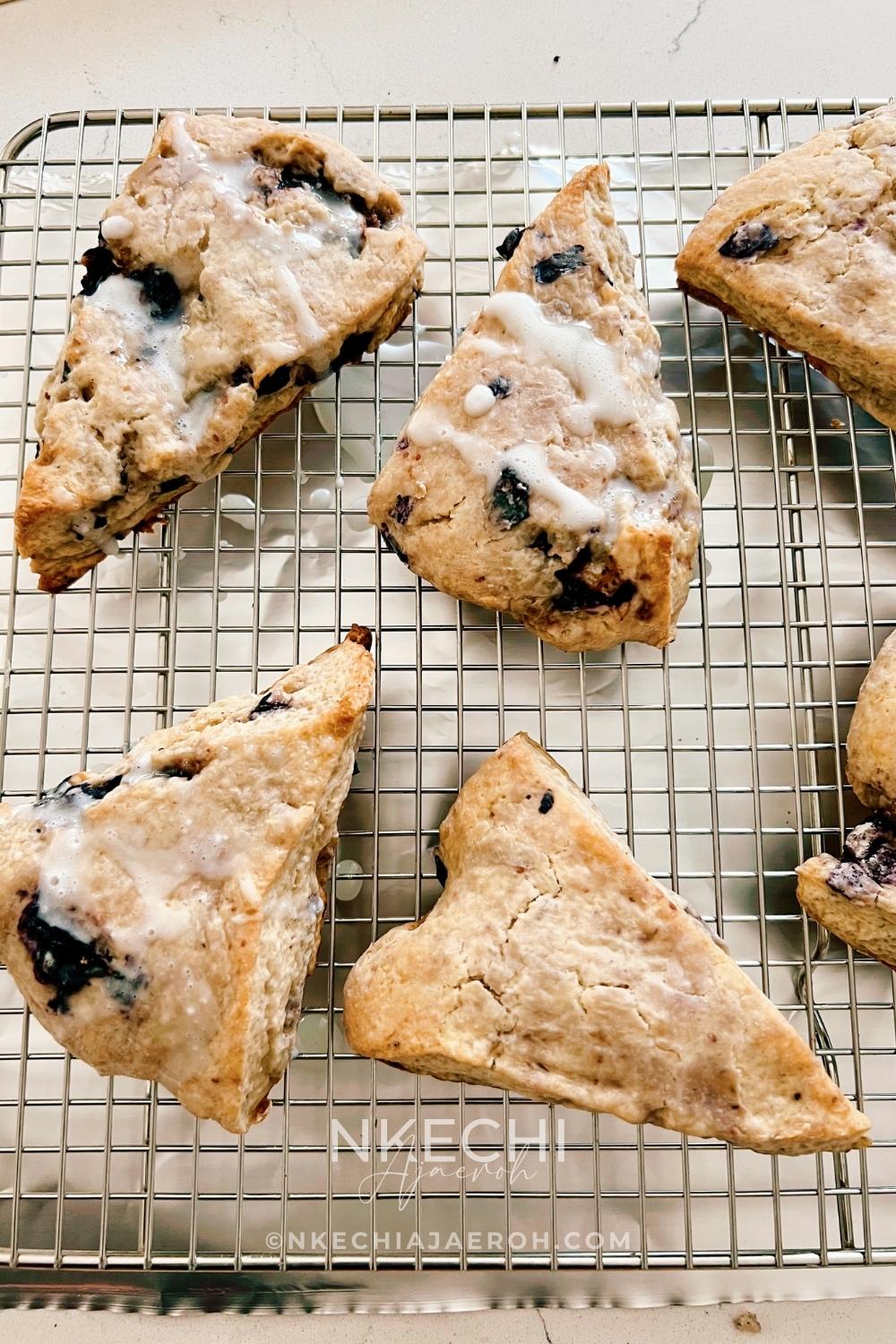 There are scones, and then there are these super sweet + nutritious blueberry scones made with frozen ripe blueberries. Wishing you could just eat those blueberry scones you saw at the bakery? Let me show you how to make your own with the sweetest and most nutritious blueberry scones recipe EVER! Made with frozen berries, you won’t have to wait for berry season to enjoy these. If you have ever had a scone before you know that you typically smash butter, cream, or fruit sauce or preserve on them but not this one! These melt-in-your-mouth blueberry scones are super sweet, rich, and decadent, and no extra accompaniment is needed.