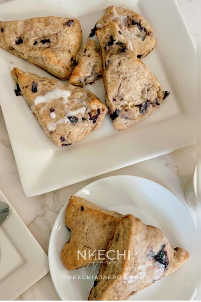 There are scones, and then there are these super sweet + nutritious blueberry scones made with frozen ripe blueberries. Wishing you could just eat those blueberry scones you saw at the bakery? Let me show you how to make your own with the sweetest and most nutritious blueberry scones recipe EVER! Made with frozen berries, you won’t have to wait for berry season to enjoy these. If you have ever had a scone before you know that you typically smash butter, cream, or fruit sauce or preserve on them but not this one! These melt-in-your-mouth blueberry scones are super sweet, rich, and decadent, and no extra accompaniment is needed. Perfect for breakfast, brunch, or just as dessert.