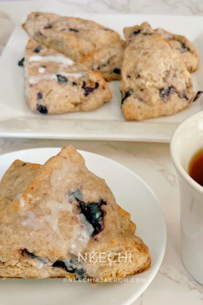 There are scones, and then there are these super sweet + nutritious blueberry scones made with frozen ripe blueberries. Wishing you could just eat those blueberry scones you saw at the bakery? Let me show you how to make your own with the sweetest and most nutritious blueberry scones recipe EVER! Made with frozen berries, you won’t have to wait for berry season to enjoy these. If you have ever had a scone before you know that you typically smash butter, cream, or fruit sauce or preserve on them but not this one! These melt-in-your-mouth blueberry scones are super sweet, rich, and decadent, and no extra accompaniment is needed. Perfect for breakfast, brunch, or just as dessert.