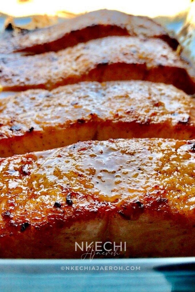 This simple oven-baked buttery honey mustard salmon recipe is first seasoned with the honey mustard sauce and then baked to perfection. These salmon are tasty, flaky, and buttery, and not to mention that they are super easy to make and require no expertise!
I have several salmon recipes on the blog, including air fryer and pan-seared salmon. However, this oven-baked buttery honey mustard salmon is our favorite. The butter, honey, and mustard are used to make this recipe unique. These will be your favorite, too! This oven-baked salmon recipe is ideal for meal prepping and can be versatile and great for special occasions.