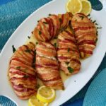 Here is how to make the most delectable oven-baked bacon wrapped chicken breasts recipe without brown sugar. This juicy and nutritious chicken recipe is easy, tasty, and such a crowd-pleaser! Bacon-Wrapped Chicken Breasts is kid-friendly as most kids love everything bacon! The ingredients for oven-baked bacon wrapped chicken breasts are simple. First of all, the chicken is well seasoned and then wrapped with bacon, protecting them from over-drying. In the end, you are left with juicy, tasty chicken breast that you can serve with any side dish.