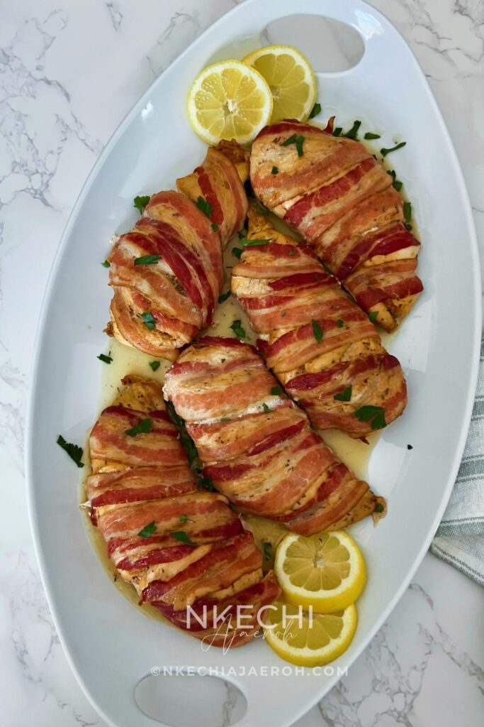 Here is how to make the most delectable oven-baked bacon wrapped chicken breasts recipe without brown sugar. This juicy and nutritious chicken recipe is easy, tasty, and such a crowd-pleaser! Bacon-Wrapped Chicken Breasts is kid-friendly as most kids love everything bacon! The ingredients for oven-baked bacon wrapped chicken breasts are simple. First of all, the chicken is well seasoned and then wrapped with bacon, protecting them from over-drying. In the end, you are left with juicy, tasty chicken breast that you can serve with any side dish.