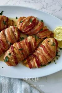 Here is how to make the most delectable oven-baked bacon wrapped chicken breasts recipe without brown sugar. This juicy and nutritious chicken recipe is easy, tasty, and such a crowd-pleaser! Bacon-Wrapped Chicken Breasts is kid-friendly as most kids love everything bacon! The ingredients for oven-baked bacon wrapped chicken breasts are simple. First of all, the chicken is well seasoned and then wrapped with bacon, protecting them from over-drying. In the end, you are left with juicy, tasty chicken breast that you can serve with any side dish.