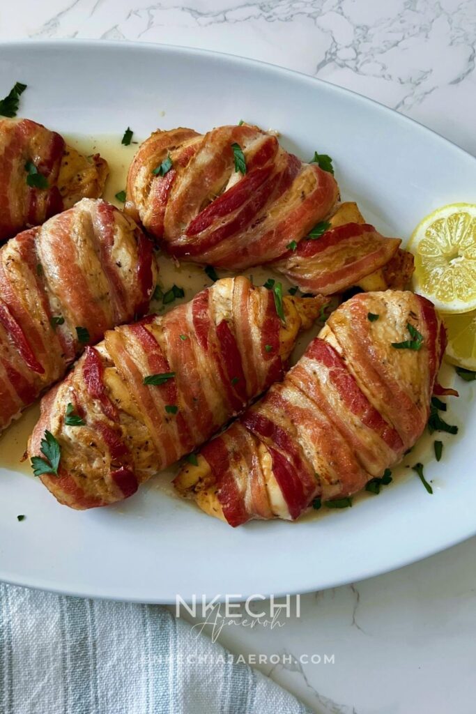 Here is how to make the most delectable oven-baked bacon wrapped chicken breasts recipe without brown sugar. This juicy and nutritious chicken recipe is easy, tasty, and such a crowd-pleaser! Bacon-Wrapped Chicken Breasts is kid-friendly as most kids love everything bacon! The ingredients for oven-baked bacon wrapped chicken breasts are simple. First of all, the chicken is well seasoned and then wrapped with bacon, protecting them from over-drying. In the end, you are left with juicy, tasty chicken breast that you can serve with any side dish.
