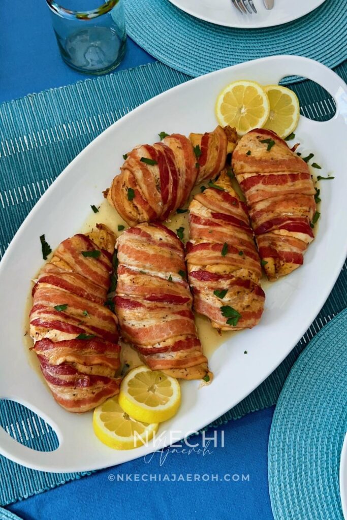 Here is how to make the most delectable oven-baked bacon wrapped chicken breasts recipe without brown sugar. This juicy and nutritious chicken recipe is easy, tasty, and such a crowd-pleaser! Bacon-Wrapped Chicken Breasts is kid-friendly as most kids love everything bacon! The ingredients for oven-baked bacon wrapped chicken breasts are simple. First of all, the chicken is well seasoned and then wrapped with bacon, protecting them from over-drying. In the end, you are left with juicy, tasty chicken breast that you can serve with any side dish.