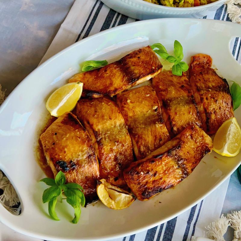 This simple oven-baked buttery honey mustard salmon recipe is first seasoned with the honey mustard sauce and then baked to perfection. These salmon are tasty, flaky, and buttery, and not to mention that they are super easy to make and require no expertise! I have several salmon recipes on the blog, including air fryer and pan-seared salmon. However, this oven-baked buttery honey mustard salmon is our favorite. The butter, honey, and mustard are used to make this recipe unique. These will be your favorite, too! This oven-baked salmon recipe is ideal for meal prepping and can be versatile and great for special occasions.