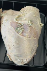 Prepare and Season the Turkey Breast Clean the turkey breast and pat it dry with paper towels. Then, place it in a large bowl. Season the turkey with all the dry seasonings- salt, Slap Ya Mama seasoning, Knorr, dry thyme, ground black pepper, and onion powder. Make sure you marinate the meat with the seasonings, then rub the herb butter all over the meat.