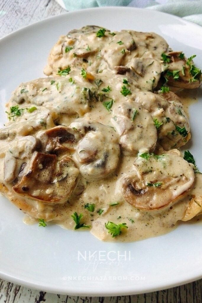 Can we take a moment to rave about this flavorful, finger-licking, good, and satisfyingly delicious creamy mushroom chicken breast recipe? This chicken dinner recipe is a win-win situation. Packed with nutritious ingredients and smothered in creamy, garlicky sauce. This is one restaurant-quality food you and your family will enjoy. It is a versatile recipe that is perfect for Sunday dinner, holidays, and still easy for weeknight meals. Need to break free from the same old dinner rotation items? Turn your chicken dinner into a culinary masterpiece with my creamy garlic mushroom chicken breast recipe. Easy enough for any night of the week, yet delicious enough for Sunday dinners and entertaining your guests. 