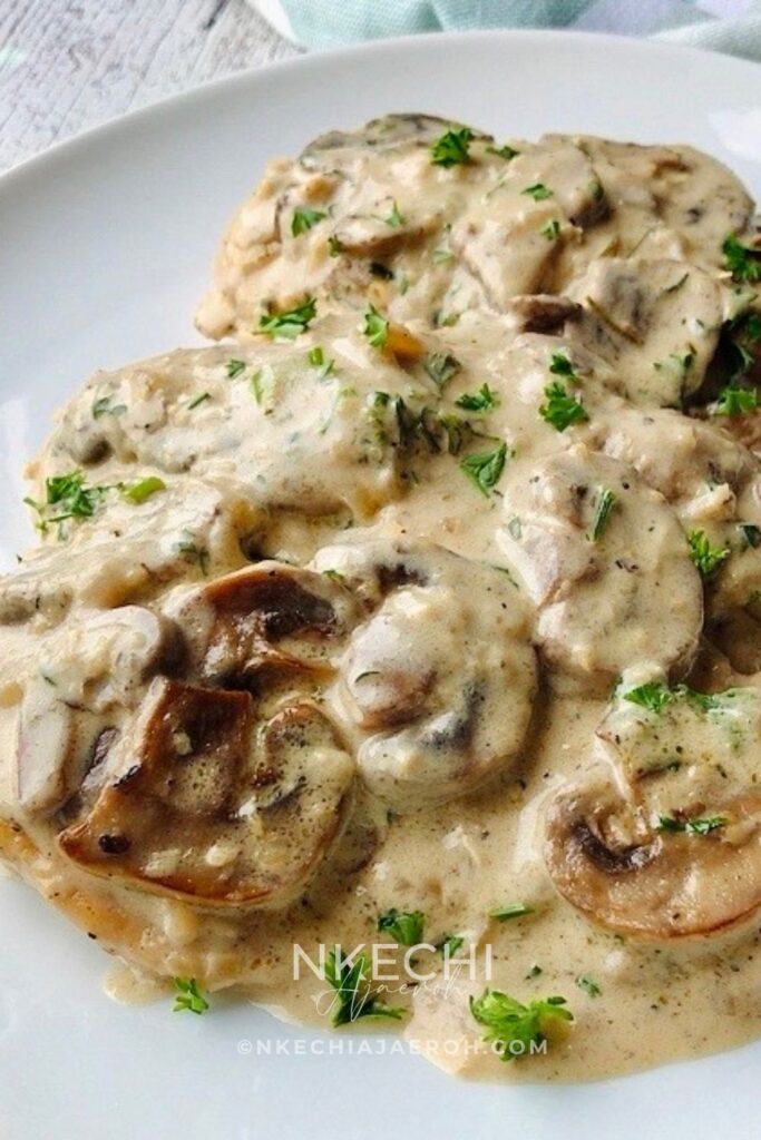 Can we take a moment to rave about this flavorful, finger-licking, good, and satisfyingly delicious creamy mushroom chicken breast recipe? This chicken dinner recipe is a win-win situation. Packed with nutritious ingredients and smothered in creamy, garlicky sauce. This is one restaurant-quality food you and your family will enjoy. It is a versatile recipe that is perfect for Sunday dinner, holidays, and still easy for weeknight meals. Need to break free from the same old dinner rotation items? Turn your chicken dinner into a culinary masterpiece with my creamy garlic mushroom chicken breast recipe. Easy enough for any night of the week, yet delicious enough for Sunday dinners and entertaining your guests. 
