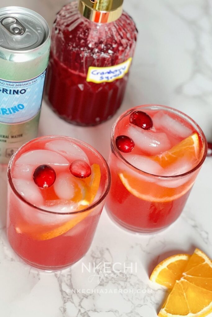 This Cranberry Citrus Sparkler is a refreshing, healthy holiday mocktail lightly sweetened with homemade sugar-free cranberry syrup. Made with real fresh cranberries, citrus, and sparkling water, it’s festive enough for Thanksgiving, Christmas, or any special celebration. It’s also perfect for everyday family dinners, making it a drink everyone can enjoy. A sparkling, antioxidant-rich holiday mocktail made with fresh cranberry syrup, citrus, and bubbly water — light, festive, and family-friendly.