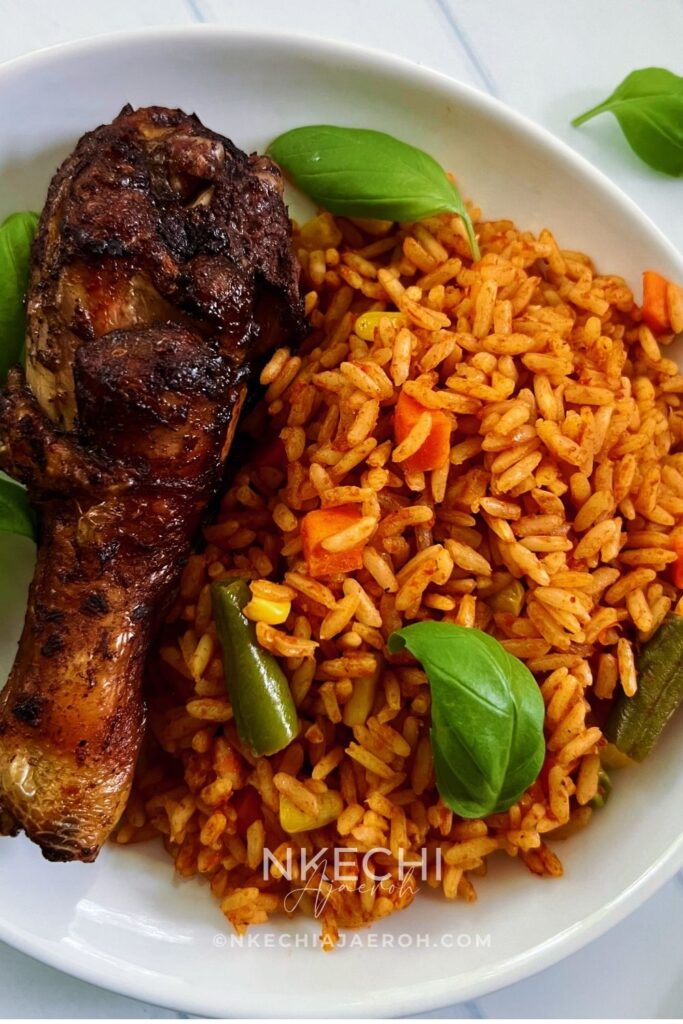 Can I Cook Baked Jollof Rice Without Coconut Milk?
Yes, absolutely — you can bake jollof rice without coconut milk. I’ve done it many times, and it works beautifully. That said, coconut milk adds a deep, slightly nutty richness. And that I personally love in baked jollof rice.
If you choose to skip the coconut milk, simply replace that quantity with more liquid from the other components. Add one extra cup of Nigerian tomato stew and one extra cup of chicken broth to make up for the coconut milk. This keeps the rice properly hydrated and ensures it cooks evenly in the oven.
See the photo below showing one of my baked jollof rice versions made without coconut milk. As you can see, it turns out great.