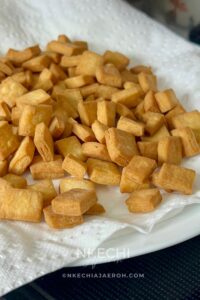 Nigerian chin chin is a popular West African snack known for its crunchy texture, buttery flavor, and lightly sweet taste. Made from a simple dough of flour, butter, sugar, eggs, and nutmeg, chin chin is rolled, cut into small pieces, and fried until golden and crisp. This classic snack is a staple at holidays, birthdays, weddings, and family gatherings, and it’s just as common to find it sold as street food. Chin chin stays crunchy for days and is easy to make in large batches, which makes it perfect for sharing and gifting.