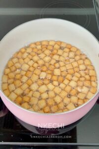 Heat vegetable oil in a deep pan over medium heat. Once the oil is hot, test it by dropping in a single piece of chin chin. If it sizzles and rises gently, you’re good to go. Fry the chin chin in batches, making sure not to overcrowd the pan. Stir occasionally and fry until they turn golden brown. Adjust the heat as needed to prevent burning or oil absorption.