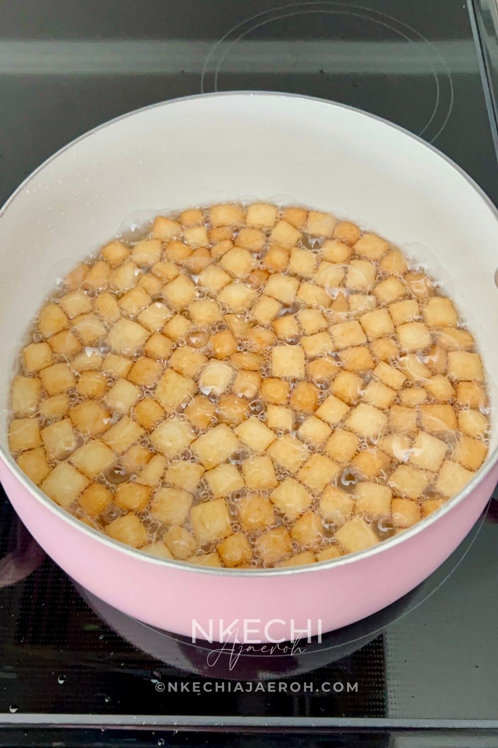 Heat vegetable oil in a deep pan over medium heat. Once the oil is hot, test it by dropping in a single piece of chin chin. If it sizzles and rises gently, you’re good to go. Fry the chin chin in batches, making sure not to overcrowd the pan. Stir occasionally and fry until they turn golden brown. Adjust the heat as needed to prevent burning or oil absorption.