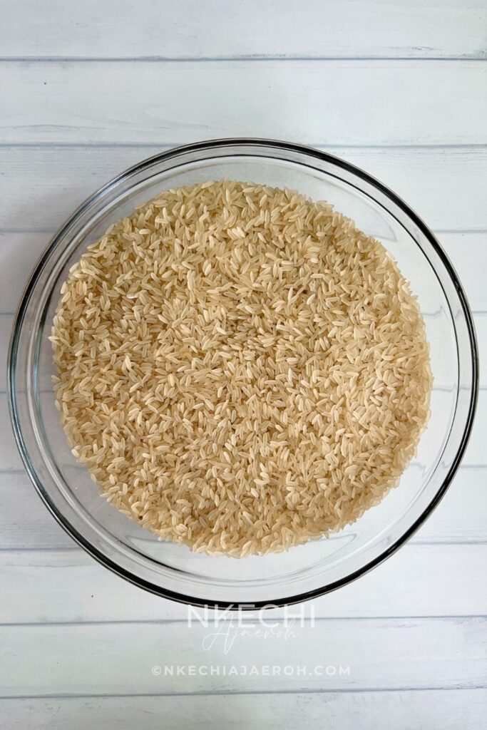 This Nigerian baked coconut jollof rice is rich, aromatic, and oven-baked for deep flavor and easy meal prep. Made with parboiled rice, coconut milk, Nigerian tomato stew, homemade chicken broth, herbs, and spices, this recipe is perfect for holidays, Sunday dinners, and freezer-friendly meals.