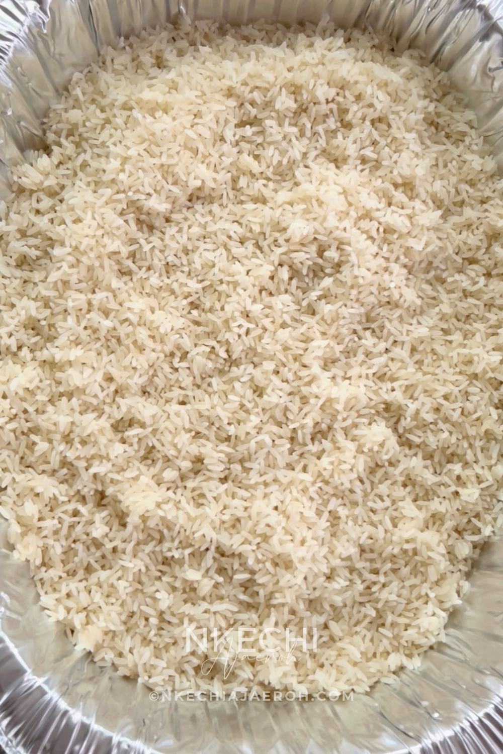 Transfer the drained rice into a large, deep baking dish or disposable aluminum foil pan. I always defer to aluminum foil because it's lightweight and I do not have to wash it afterwards.