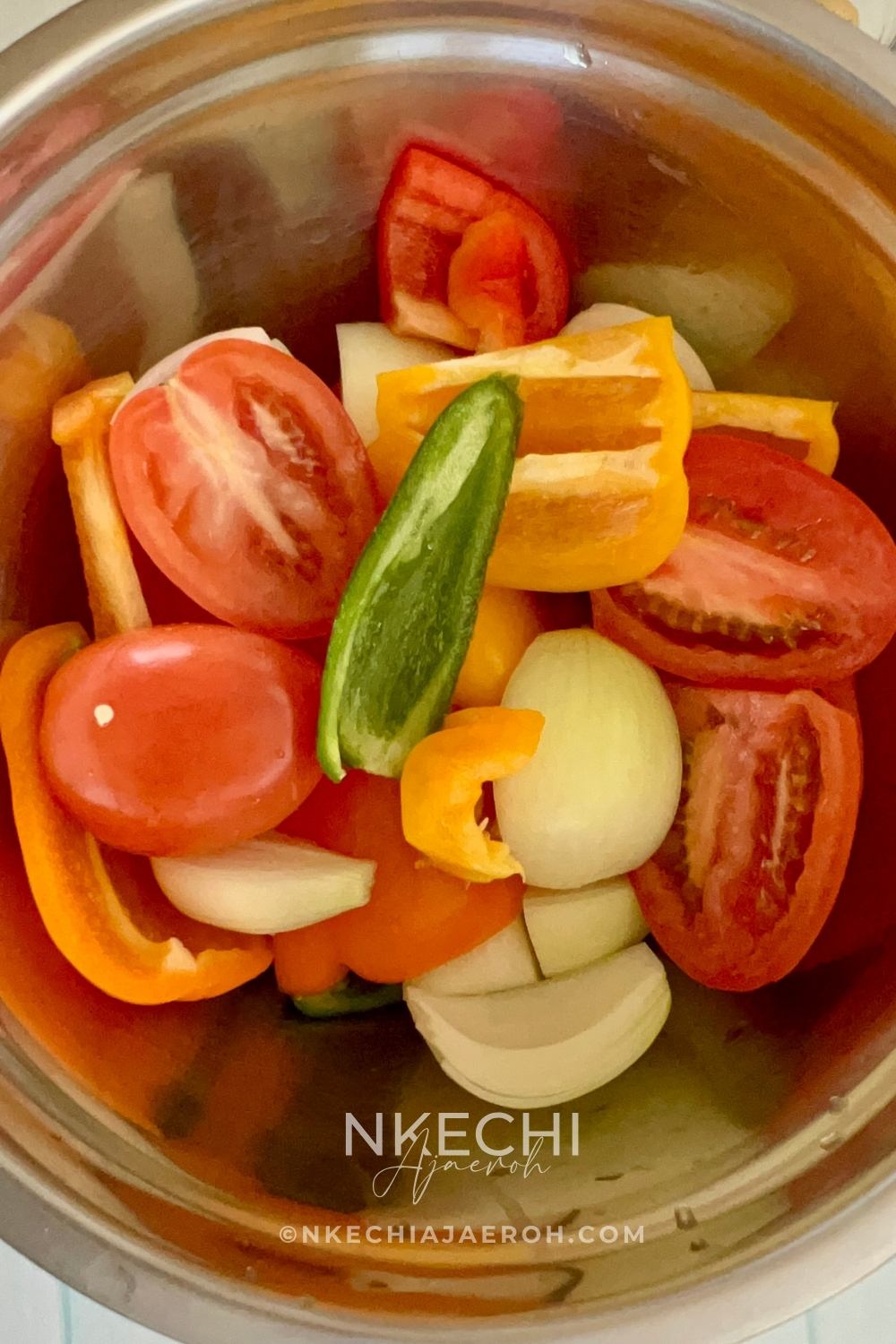 Wash all vegetables thoroughly. Halve the tomatoes. Cut bell peppers and remove seeds, Next, cut onions into halves or quarters. Make sure to peel garlic and remove the stems from Jalapeño and Habanero as well.
