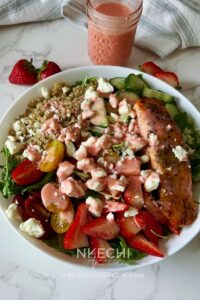 Looking for the perfect healthy summer salad? This Salmon Strawberry Quinoa Arugula Salad is inspired by one of my favorite restaurant bowls and combines perfectly seasoned salmon, fluffy quinoa, peppery arugula, juicy strawberries, cucumbers, tomatoes, feta, and a homemade fresh strawberry dressing. It's high in protein, meal-prep friendly, and ready in about 20 minutes. Perfect for lunch, dinner, or whenever you need a fresh, satisfying meal.