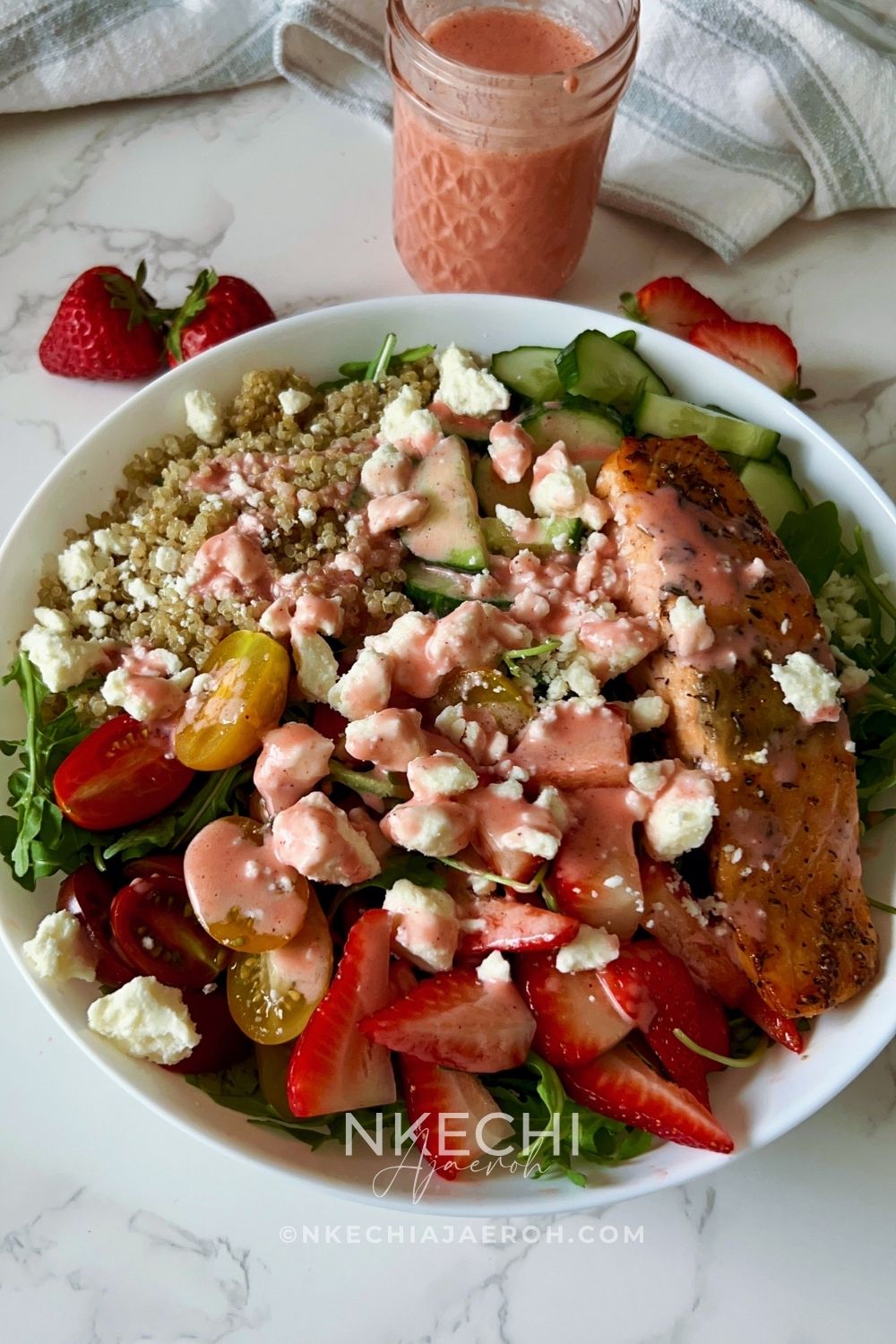 Looking for the perfect healthy summer salad? This Salmon Strawberry Quinoa Arugula Salad is inspired by one of my favorite restaurant bowls and combines perfectly seasoned salmon, fluffy quinoa, peppery arugula, juicy strawberries, cucumbers, tomatoes, feta, and a homemade fresh strawberry dressing. It's high in protein, meal-prep friendly, and ready in about 20 minutes. Perfect for lunch, dinner, or whenever you need a fresh, satisfying meal.