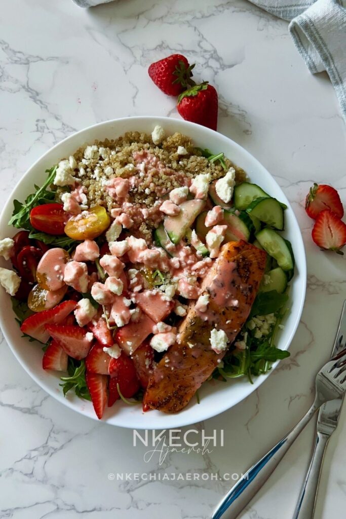Looking for the perfect healthy summer salad? This Salmon Strawberry Quinoa Arugula Salad is inspired by one of my favorite restaurant bowls and combines perfectly seasoned salmon, fluffy quinoa, peppery arugula, juicy strawberries, cucumbers, tomatoes, feta, and a homemade fresh strawberry dressing. It's high in protein, meal-prep friendly, and ready in about 20 minutes. Perfect for lunch, dinner, or whenever you need a fresh, satisfying meal.
