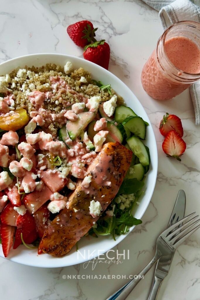 Looking for a healthy, high-protein summer salad? This Salmon Strawberry Quinoa Salad is a fresh, high-protein meal inspired by one of my favorite CAVA bowls. Made with perfectly seasoned salmon, fluffy quinoa, peppery arugula, juicy strawberries, crisp vegetables, creamy feta, and a homemade strawberry dressing, it's an easy, restaurant-worthy salad you'll want to make all summer long.