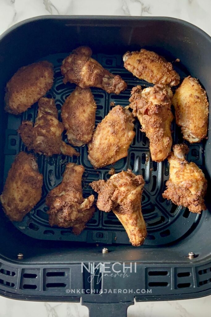 These Air Fryer Nigerian Chicken Suya Wings are juicy, crispy, spicy, and loaded with authentic 9ja flavor! Chicken wings are generously seasoned with yaji/suya pepper and air-fried until perfectly cooked and crisp. Serve these easy Nigerian suya wings with fresh onions and tomatoes, enjoy them as an appetizer, or pair them with jollof rice for dinner. A must-try Nigerian chicken recipe for suya lovers!