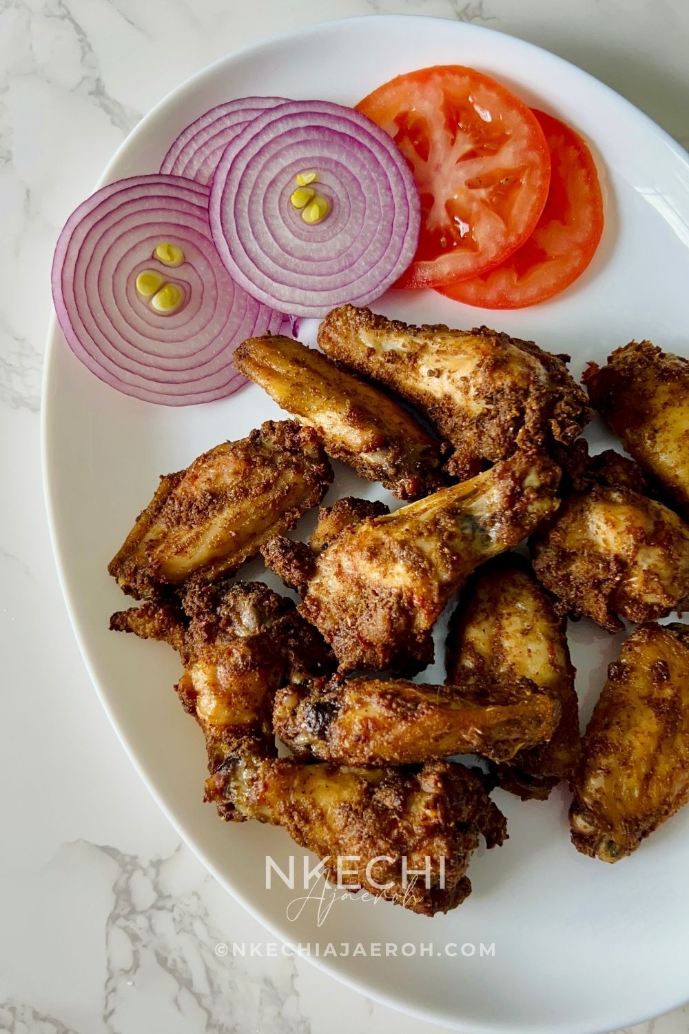 Nigerian suya is one of those authentic Nigerian foods you have to try at least once in your lifetime. It is so distinct and different from just about any other spicy meat recipe you may have had. One of the best things about Nigerian suya is that you can make it with different types of meat: beef (the original), chicken, turkey, pork, or even goat meat. Personally, I make chicken suya the most. Make sure to check out my Chicken Breast Suya Skewers, and for all my wings-loving friends, this Air Fryer Nigerian Suya Chicken Wings is for you! The best part? These wings cook quickly and easily in the air fryer.