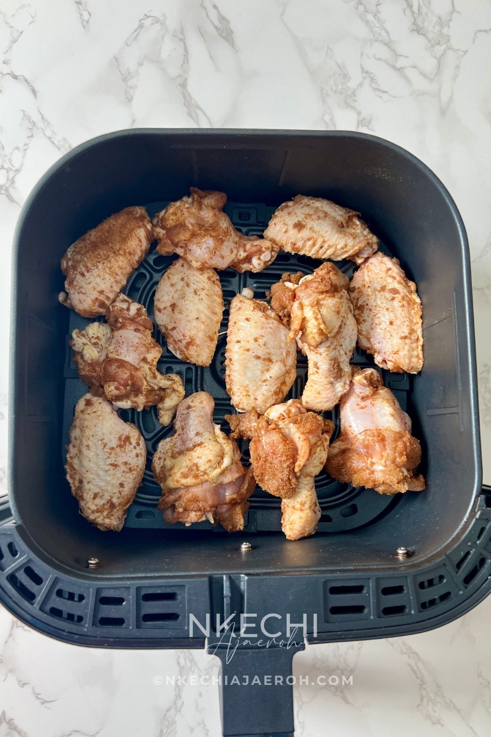 These Air Fryer Nigerian Chicken Suya Wings are juicy, crispy, spicy, and loaded with authentic 9ja flavor! Chicken wings are generously seasoned with yaji/suya pepper and air-fried until perfectly cooked and crisp. Serve these easy Nigerian suya wings with fresh onions and tomatoes, enjoy them as an appetizer, or pair them with jollof rice for dinner. A must-try Nigerian chicken recipe for suya lovers!