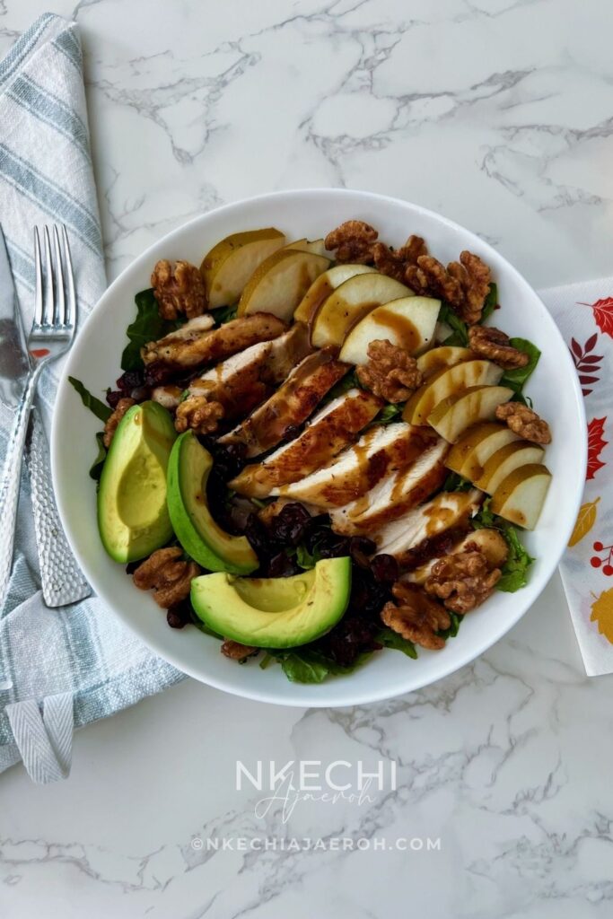 Looking for an easy healthy chicken salad? This Chicken Pear Salad is loaded with juicy chicken, fresh pear, avocado, dried cranberries, toasted walnuts, and mixed greens, then finished with a simple balsamic maple dressing. It's an easy high-protein salad for lunch or dinner and a delicious way to use leftover chicken. Perfect for fall, but delicious any time you can find good pears!