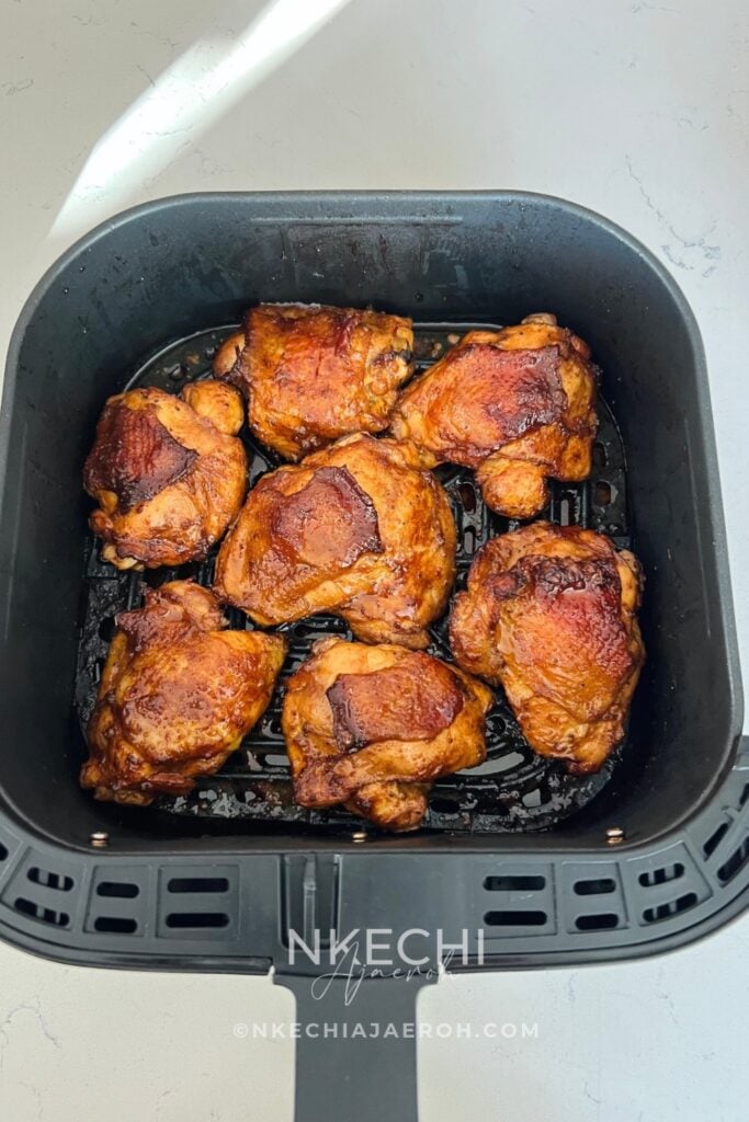 Looking for a flavorful air fryer chicken dinner? These juicy Air Fryer Peruvian Chicken Thighs are marinated with ají amarillo paste, fresh lime, garlic, soy sauce, and warm spices, then cooked until beautifully golden. Serve with creamy homemade aji verde sauce for a delicious Peruvian-inspired meal! Perfect for family dinners, meal prep, or entertaining. Save this easy air fryer chicken recipe for later!
