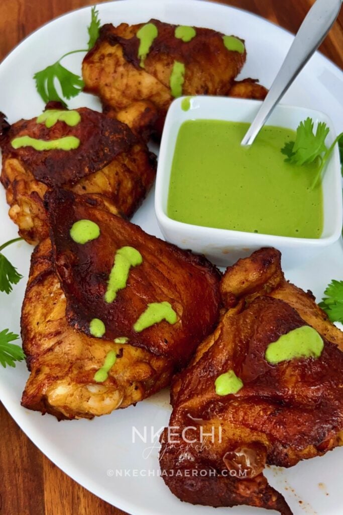 Looking for a flavorful air fryer chicken dinner? These juicy Air Fryer Peruvian Chicken Thighs are marinated with ají amarillo paste, fresh lime, garlic, soy sauce, and warm spices, then cooked until beautifully golden. Serve with creamy homemade aji verde sauce for a delicious Peruvian-inspired meal! Perfect for family dinners, meal prep, or entertaining. Save this easy air fryer chicken recipe for later!