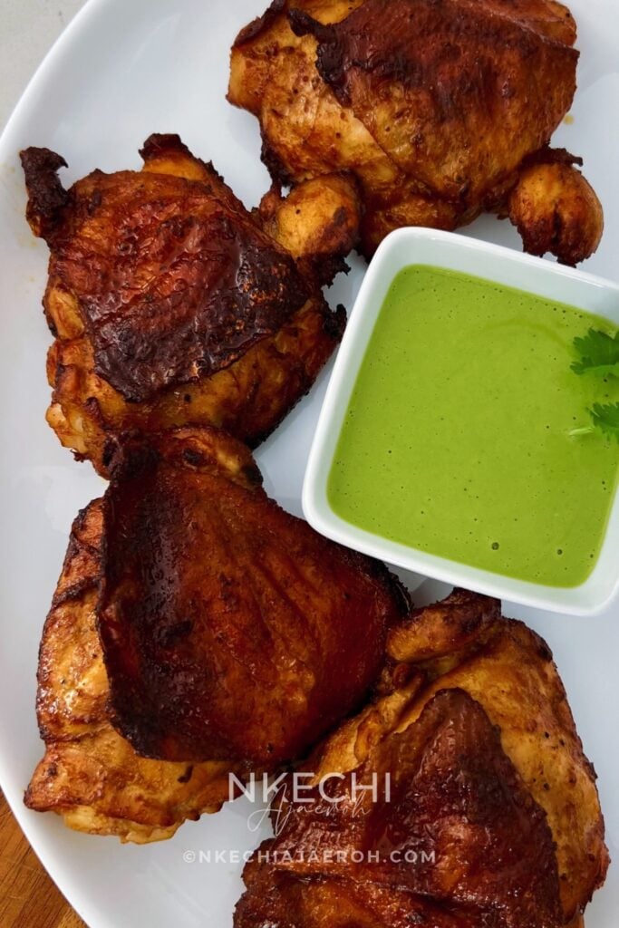 Looking for a flavorful air fryer chicken dinner? These juicy Air Fryer Peruvian Chicken Thighs are marinated with ají amarillo paste, fresh lime, garlic, soy sauce, and warm spices, then cooked until beautifully golden. Serve with creamy homemade aji verde sauce for a delicious Peruvian-inspired meal! Perfect for family dinners, meal prep, or entertaining. Save this easy air fryer chicken recipe for later!