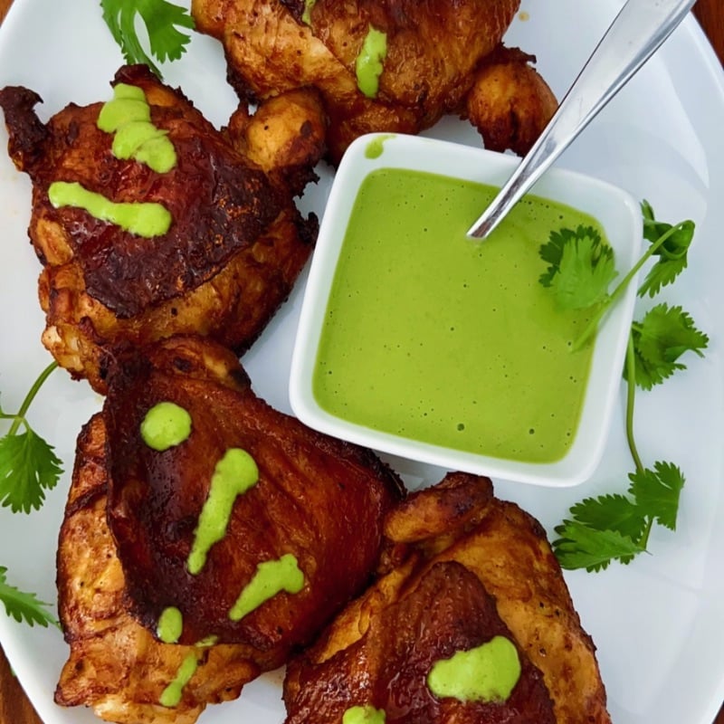 These Air Fryer Peruvian Chicken Thighs are juicy, beautifully seasoned, and packed with flavor! Marinated with ají amarillo paste, lime, garlic, soy sauce, and warm spices, then air-fried until deliciously golden. Serve with creamy homemade aji verde sauce for an easy, flavorful chicken dinner that's perfect for family meals or entertaining.
