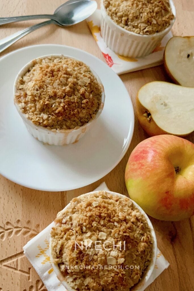 This easy Apple Pear Crisp is the cozy fruit dessert you'll want all fall and winter! Juicy apples and pears, tart dried cranberries, fresh citrus, cinnamon, and nutmeg are baked under a buttery oat crumble until golden and bubbly. Make individual apple pear crisps in ramekins for family dinner, Thanksgiving, Christmas, or an easy cold-weather dessert.