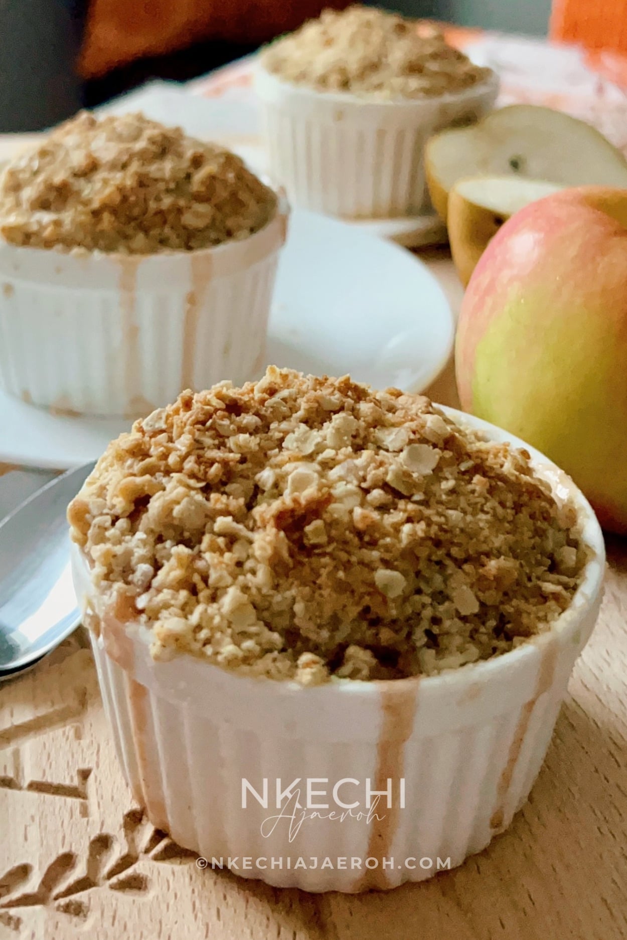 This easy Individual Apple Pear Crisp with Cranberries combines juicy pears, crisp apples, dried cranberries, citrus, and warm spices under a buttery oat topping. Baked in individual ramekins, this cozy fall and winter dessert is perfect for family dinners, Thanksgiving, Christmas, and holiday entertaining!