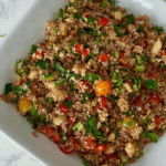 Looking for an easy, colorful Mediterranean Bulgur Salad? This delicious bulgur wheat salad combines nutty red bulgur, crisp vegetables, sweet apples, fresh parsley, and a zesty lemon date dressing with a touch of date syrup. Naturally dairy-free and made without feta, it's perfect for healthy meal prep, weekday lunches, family dinners, or serving alongside chicken, salmon, or lamb. A fresh, nourishing Mediterranean grain salad that's easy to customize with your favorite vegetables. Save this recipe for later!