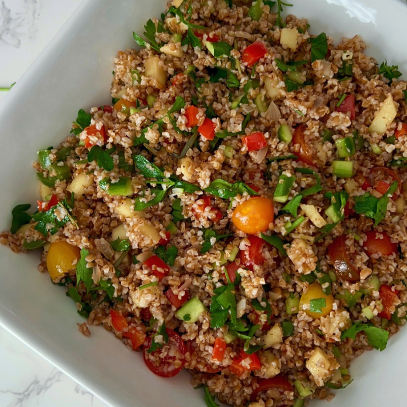Looking for an easy, colorful Mediterranean Bulgur Salad? This delicious bulgur wheat salad combines nutty red bulgur, crisp vegetables, sweet apples, fresh parsley, and a zesty lemon date dressing with a touch of date syrup. Naturally dairy-free and made without feta, it's perfect for healthy meal prep, weekday lunches, family dinners, or serving alongside chicken, salmon, or lamb. A fresh, nourishing Mediterranean grain salad that's easy to customize with your favorite vegetables. Save this recipe for later!