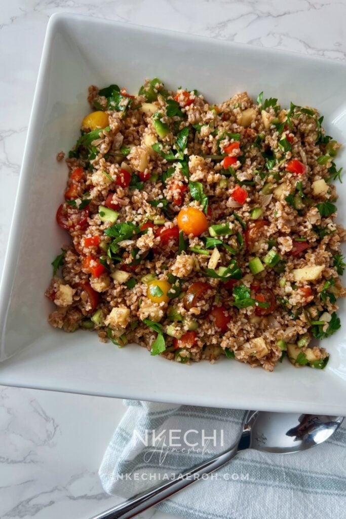 Looking for an easy, colorful Mediterranean Bulgur Salad? This delicious bulgur wheat salad combines nutty red bulgur, crisp vegetables, sweet apples, fresh parsley, and a zesty lemon date dressing with a touch of date syrup. Naturally dairy-free and made without feta, it's perfect for healthy meal prep, weekday lunches, family dinners, or serving alongside chicken, salmon, or lamb. A fresh, nourishing Mediterranean grain salad that's easy to customize with your favorite vegetables. Save this recipe for later! 