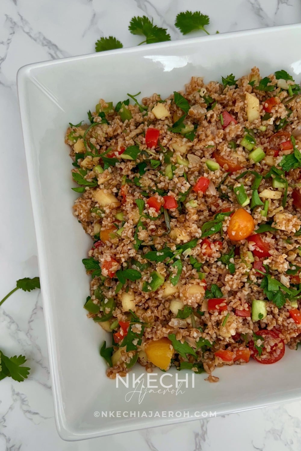 Looking for an easy, colorful Mediterranean Bulgur Salad? This delicious bulgur wheat salad combines nutty red bulgur, crisp vegetables, sweet apples, fresh parsley, and a zesty lemon date dressing with a touch of date syrup. Naturally dairy-free and made without feta, it's perfect for healthy meal prep, weekday lunches, family dinners, or serving alongside chicken, salmon, or lamb. A fresh, nourishing Mediterranean grain salad that's easy to customize with your favorite vegetables. Save this recipe for later! 